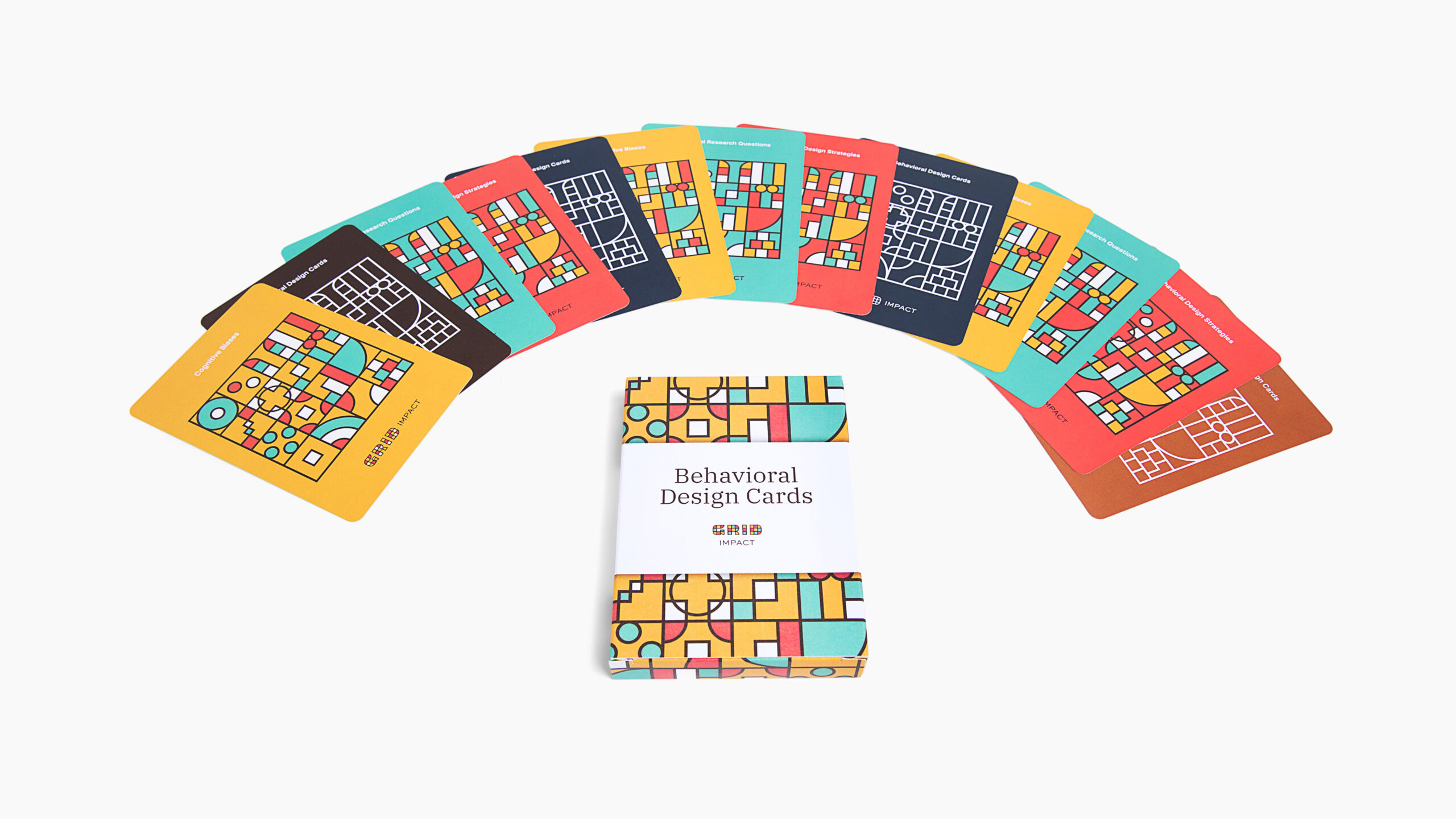 GRID-Impact-09 A photo of the Behavioral Design Cards carddeck box with the cards layed out around it