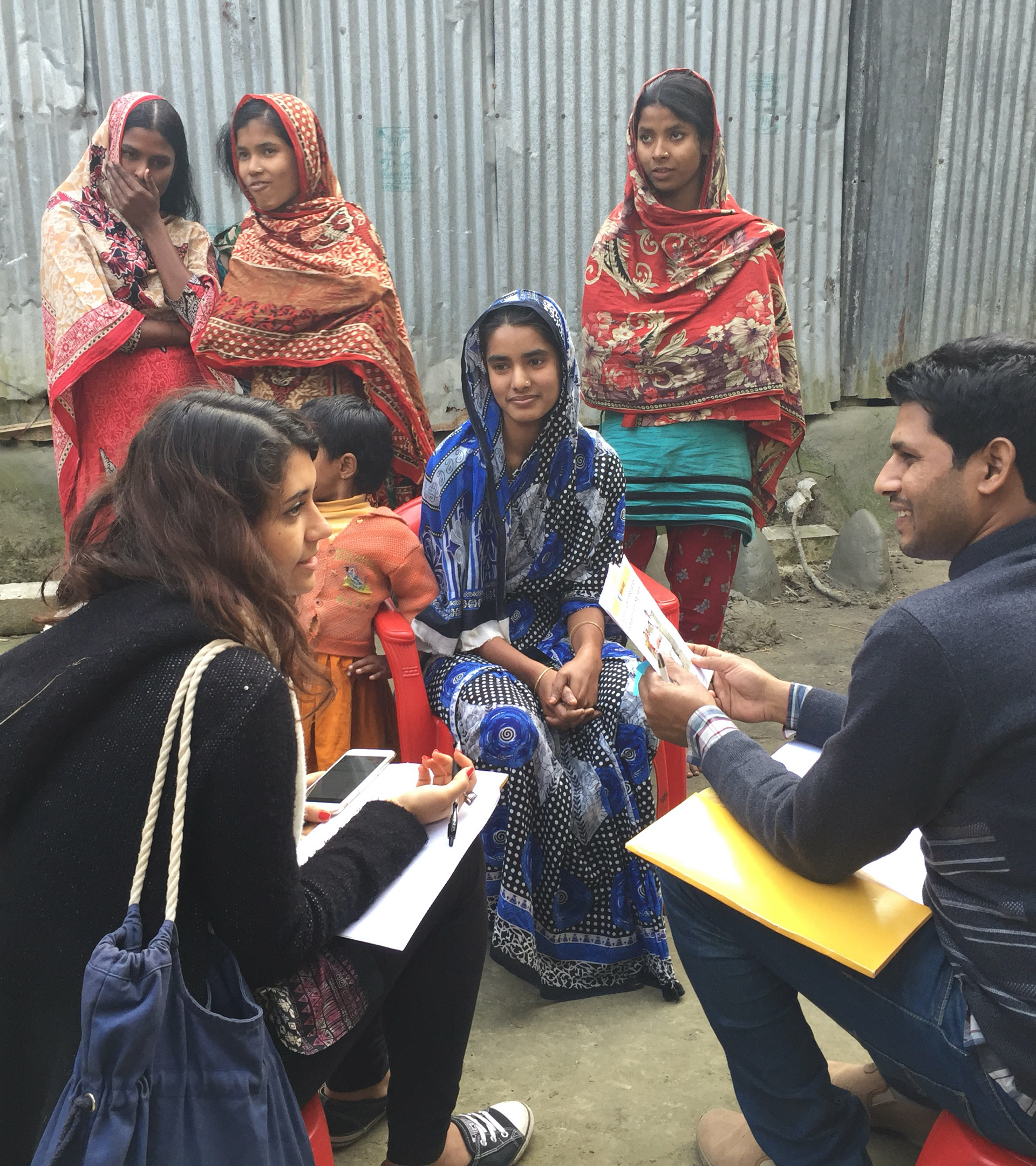 GRID-Impact-32 A group of people discussing a project outside