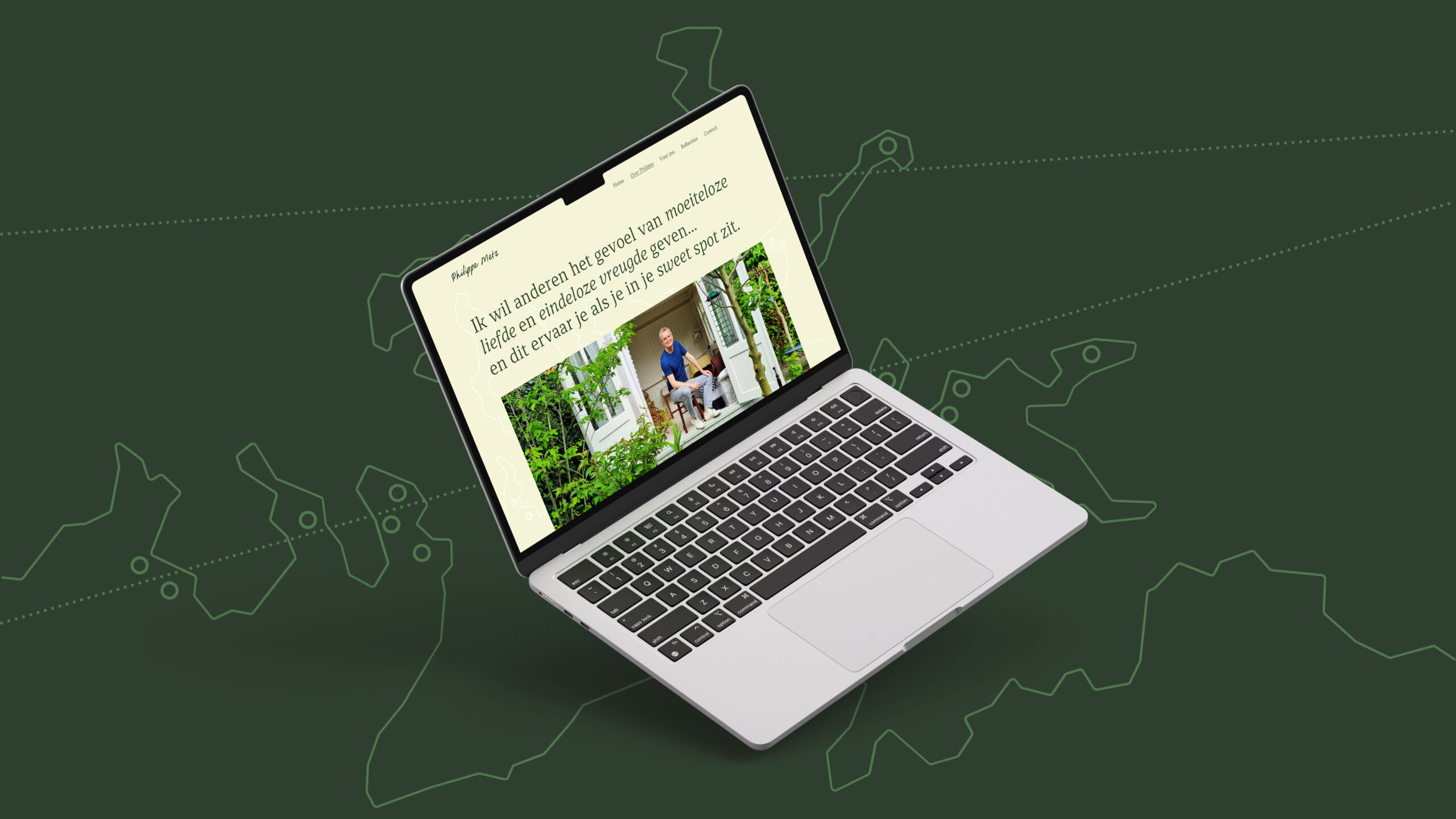 Philippe-Metz-Website-01 A dark green background with a floating laptop on it. The laptop shows a light green website.